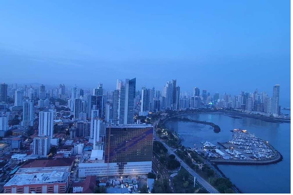 Panama City skyline at dusk, the gateway to Coiba