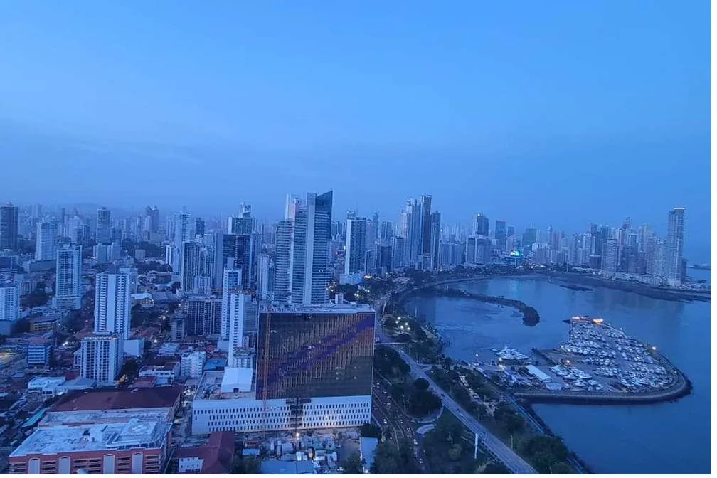 Panama City skyline at dusk — the gateway to Coiba